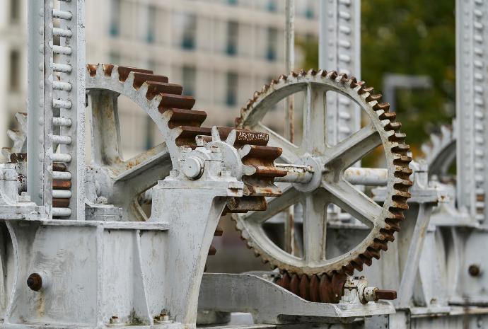 selective focus photography of machine with gears